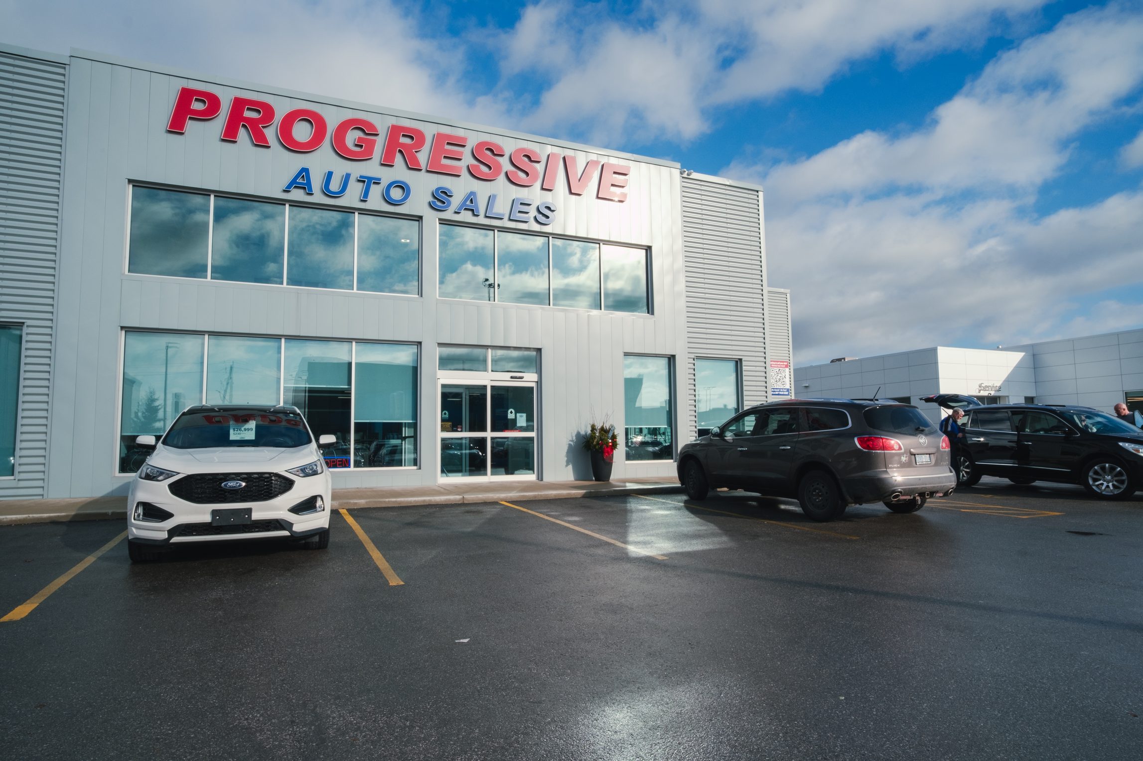 Progressive Auto Sales storefront and lot